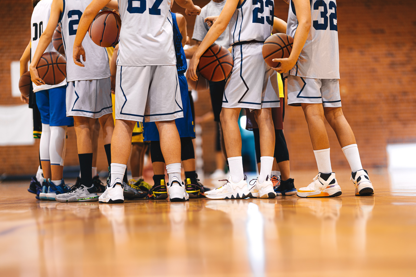 Strength in Unity: Basketball Team Huddling Together for Victory